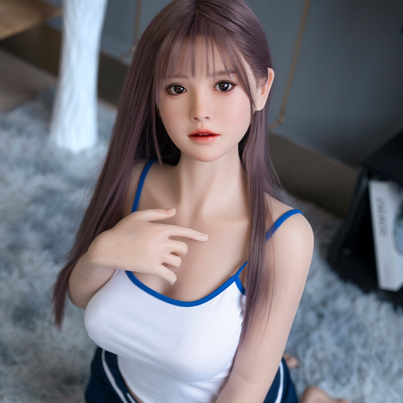 Cailin, an Asian woman with long hair, large breasts, and a full-body silicone sex doll.
