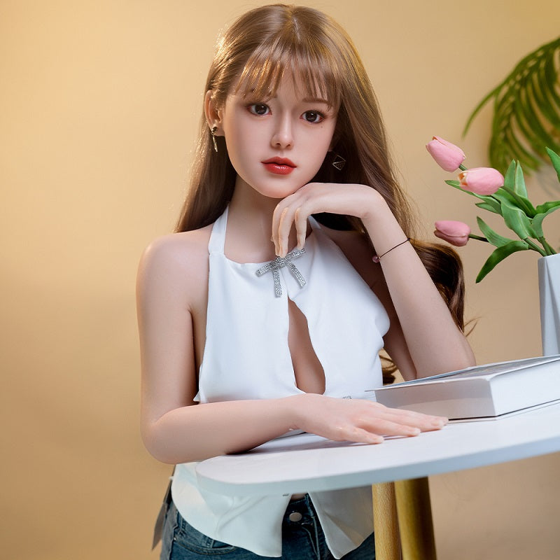 Haiyue, an Asian woman with long hair, full breasts, and a full-body silicone sex doll.