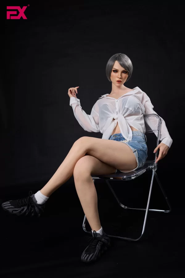 Scarlett, a mature, gray-haired, large-breasted silicone sex doll.