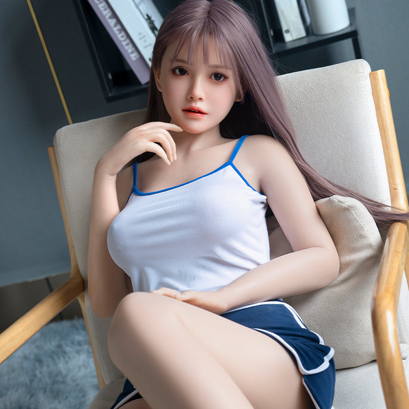 Cailin, an Asian woman with long hair, large breasts, and a full-body silicone sex doll.