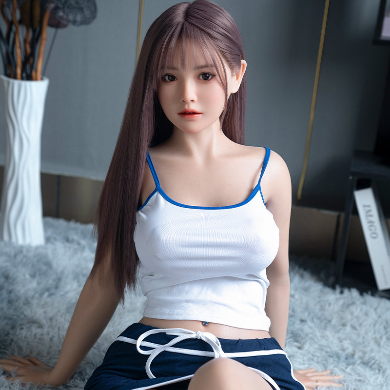 Cailin, an Asian woman with long hair, large breasts, and a full-body silicone sex doll.