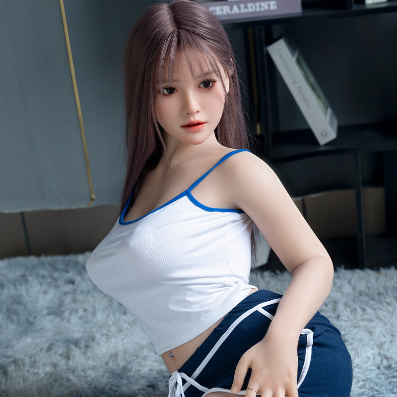 Cailin, an Asian woman with long hair, large breasts, and a full-body silicone sex doll.