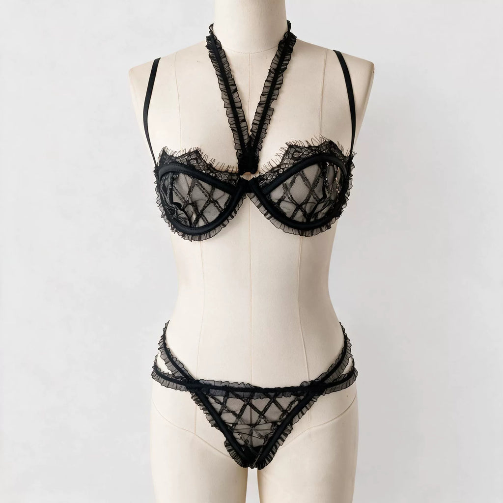 New French-style sexy lingerie set featuring a geometric grid-patterned mesh bra with sequin detailing and lettuce-edge trim, designed to minimize the appearance of a larger bust.
