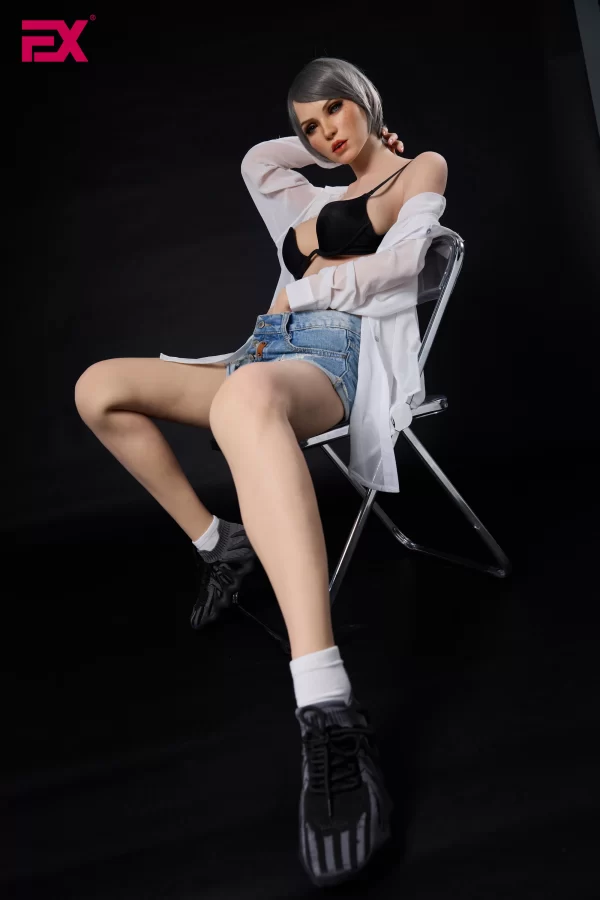 Scarlett, a mature, gray-haired, large-breasted silicone sex doll.
