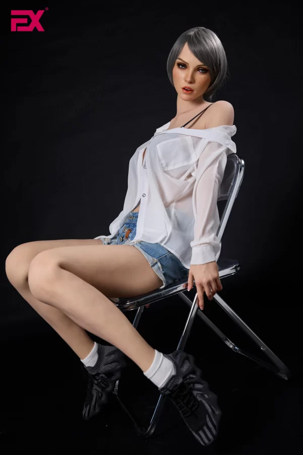 Scarlett, a mature, gray-haired, large-breasted silicone sex doll.