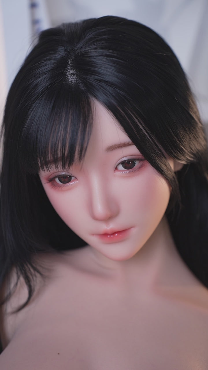 Mu Yao, a trendy Asian woman with long black hair, is a full-body silicone sex doll.