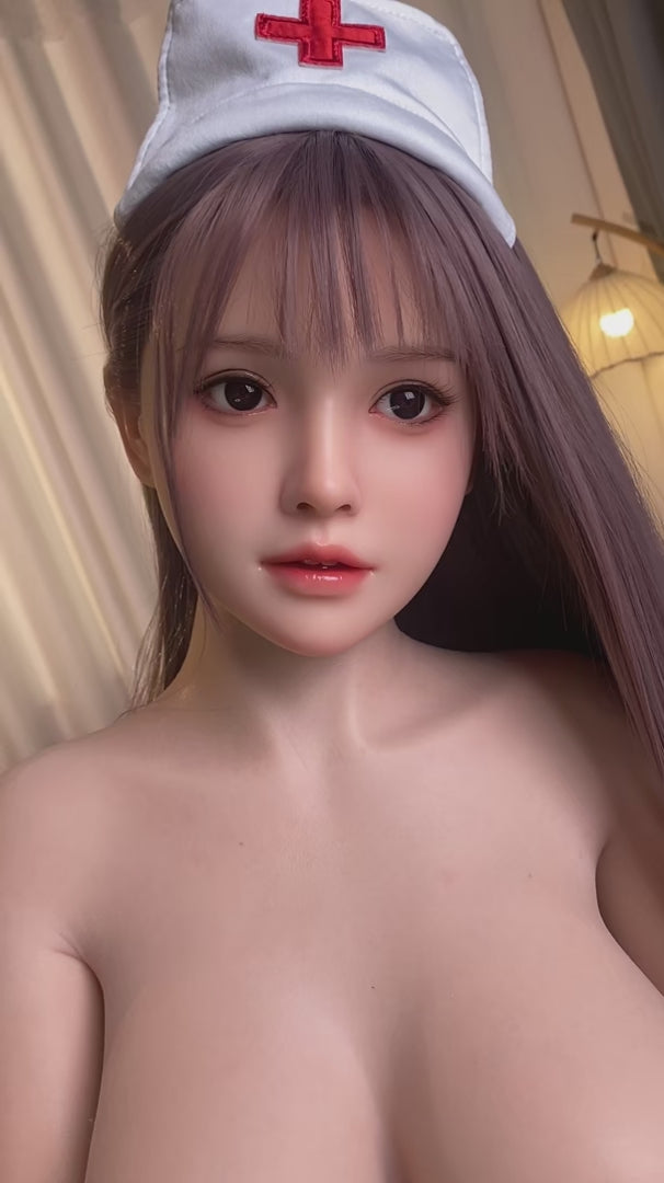 Karin, a nurse in uniform, Asian, with long hair, full breasts, and a full-body silicone sex doll.