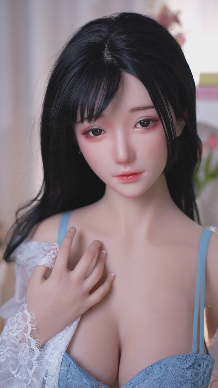 Mu Yao, a trendy Asian woman with long black hair, is a full-body silicone sex doll.